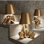 Radiate Elegance: Illuminate Your Space with the Little Golden Man Table Lamp